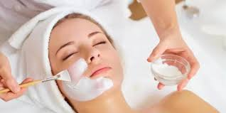 Professional facial treatment with mask application in a bright, relaxing spa space
