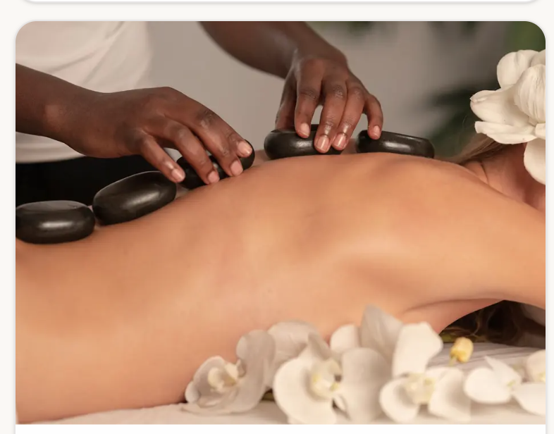 Black basalt hot stones along the spine during a hot stone massage